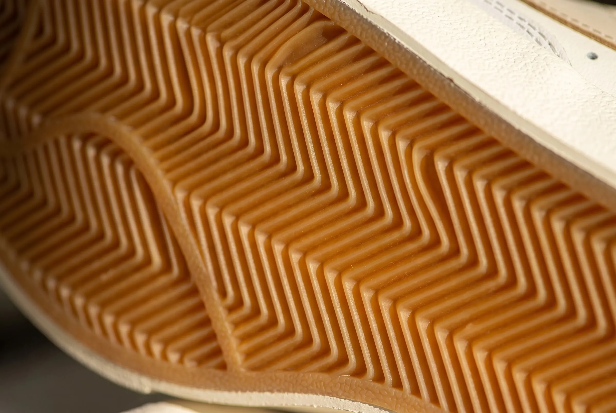 Close-up of a gum rubber outsole with a herringbone tread