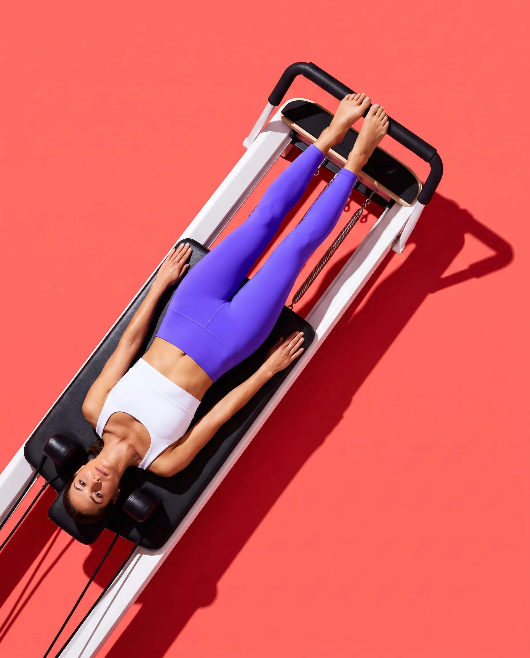 Overhead view of footwork on a reformer carriage